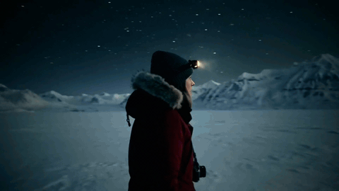 One consistent character across a directed arctic night: a trek under the stars, the first aurora, the whole sky ablaze, and the walk home at dawn