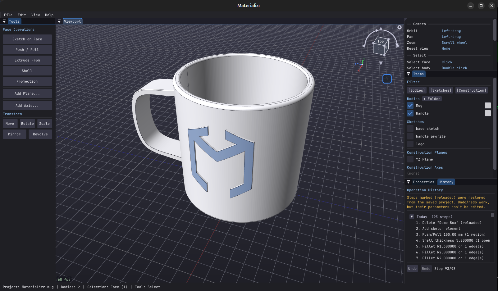 Materializr modeling a coffee mug with filleted rim, handle, and embossed logo wrapped around the cylindrical face